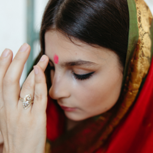 Applying bindi as indian tradition